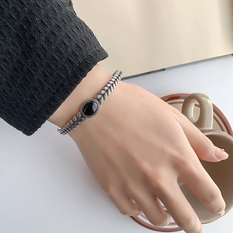 Black onyx bracelet with retro wheat stitching for protection for women.