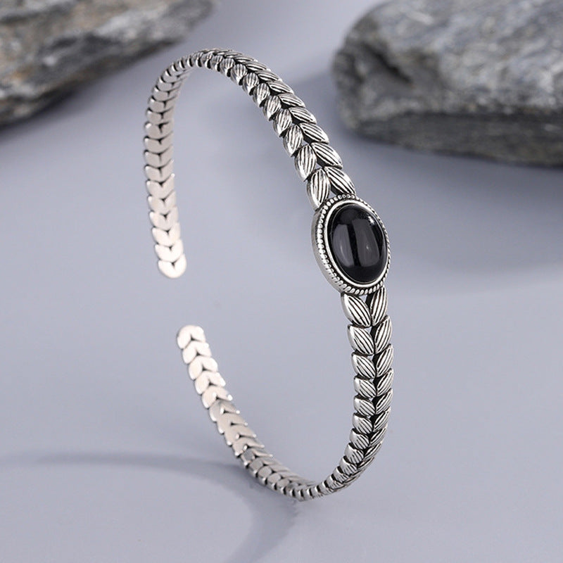Black onyx bracelet with retro wheat stitching for protection for women.